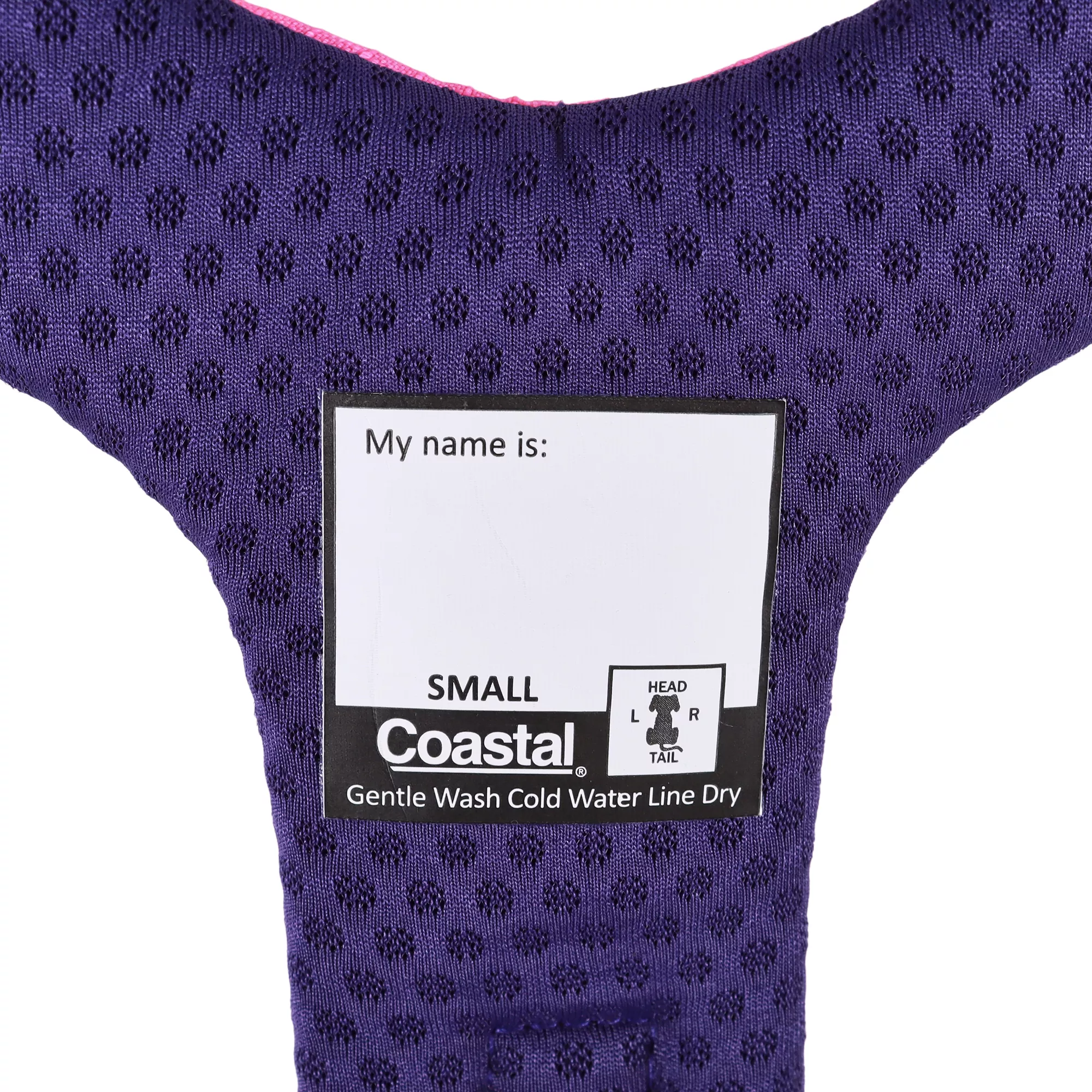 The interior of a Rosewood‑colored dog harness is displayed against a white background. The inside panel features dark purple honeycomb‑patterned padding. A white printed tag reads “My name is:” above a blank writable space. A woven brand label is stitched below the tag. Reinforced stitching outlines the curved interior structure of the harness.